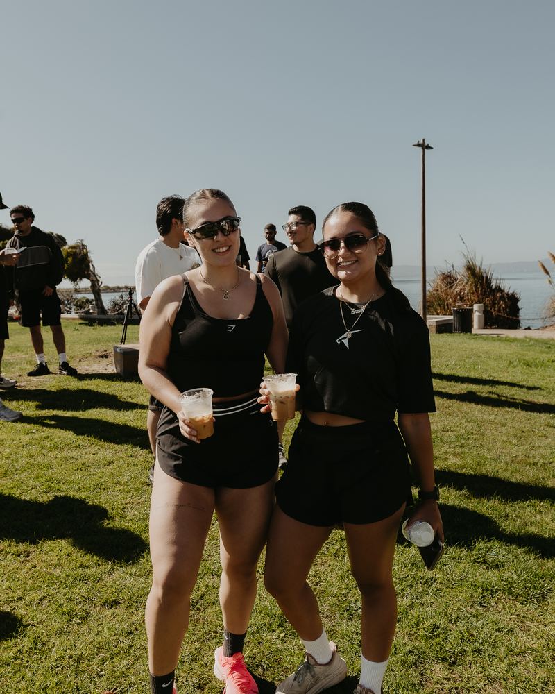 Two runners with iced coffees after the run